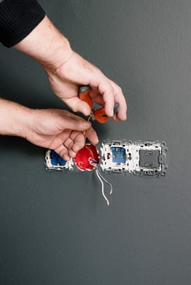Electrician Checking Switches Electrician Checking Switches